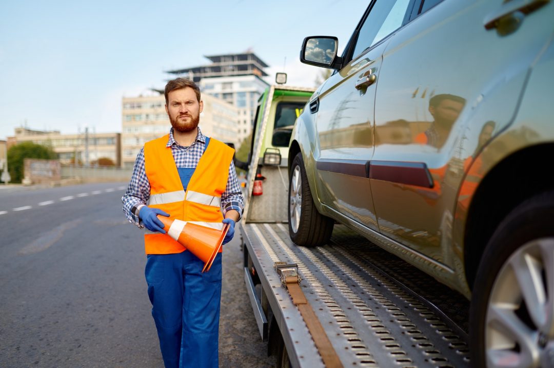 Home 2 road worker putting traffic cone on roadside
